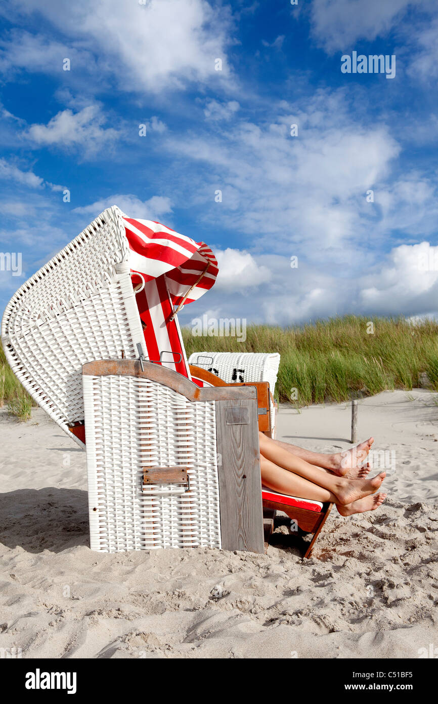 young couple relaxing in beach chair Stock Photo - Alamy