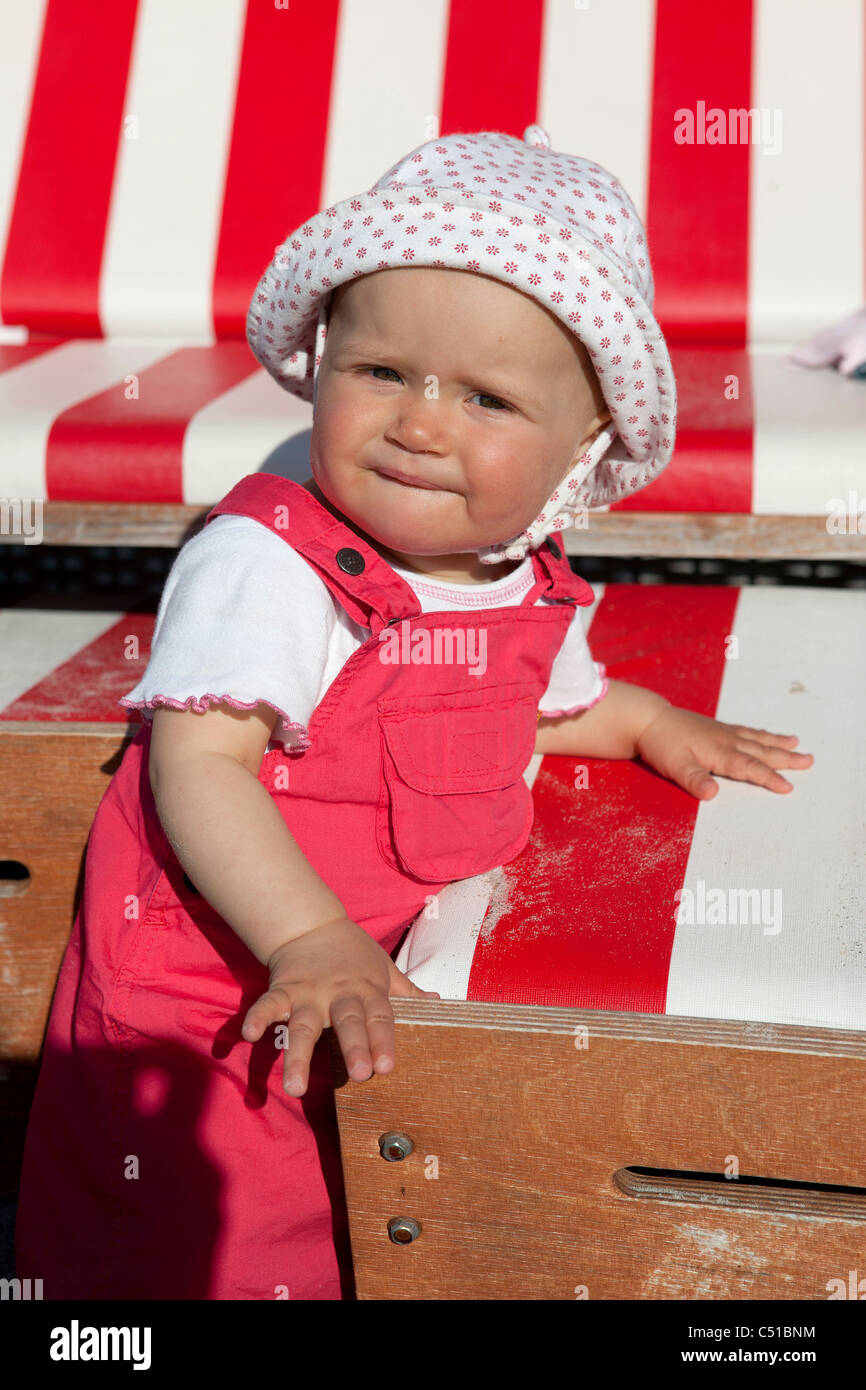 portrait of baby girl at beach chair Stock Photo Alamy