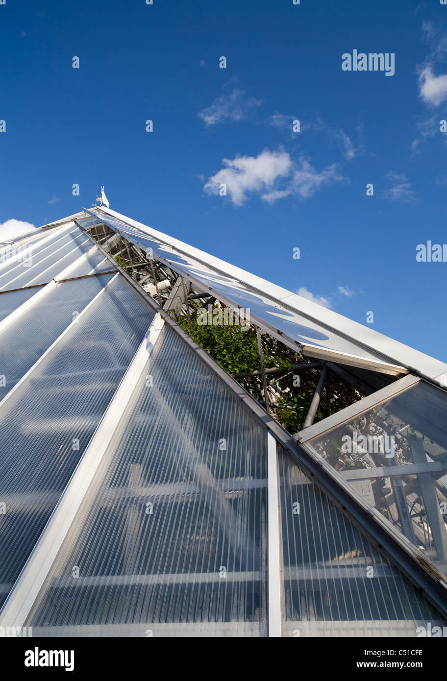 Hothouse ventilation system uses motor driven glass windows for cooling the air inside the hothouse , Finland Stock Photo