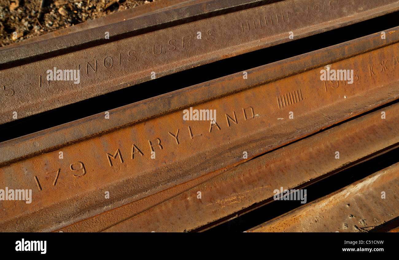 Decommissioned old railroad rails made in Maryland Illinois USA at 1915 Stock Photo