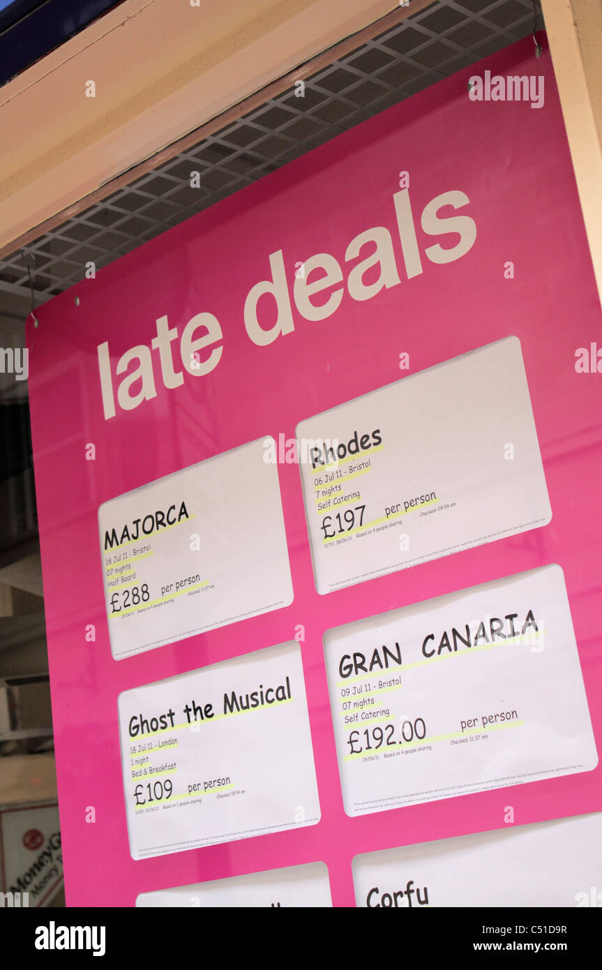 Late Deals in UK travel agency window Stock Photo Alamy