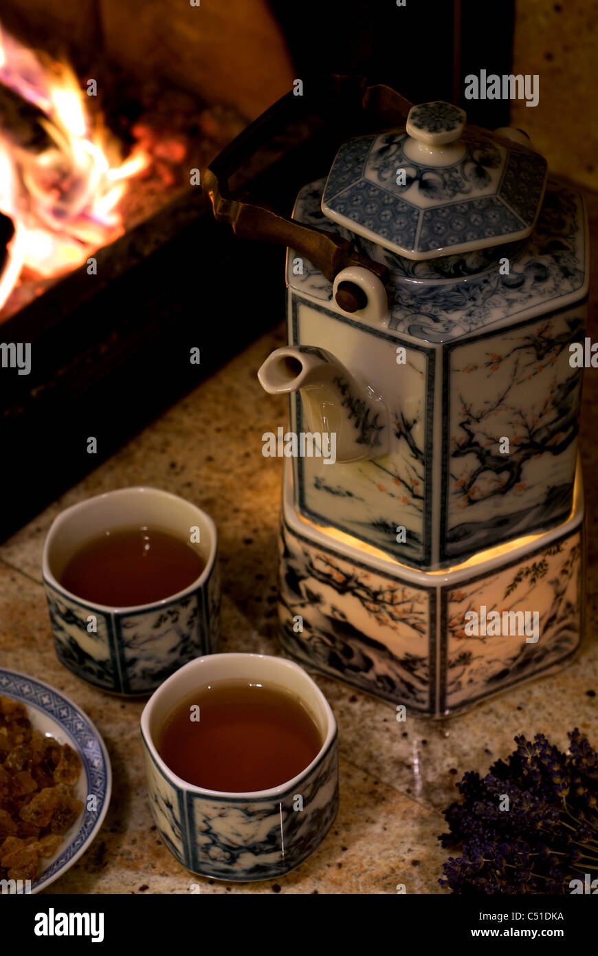 A tea ceremony at a fireplace Stock Photo