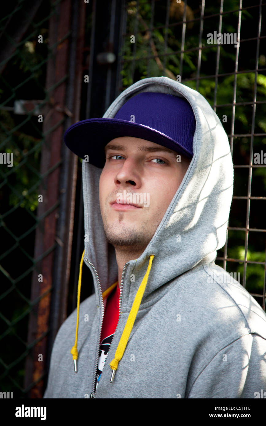 Young man wearing a cap with hoodie Stock Photo