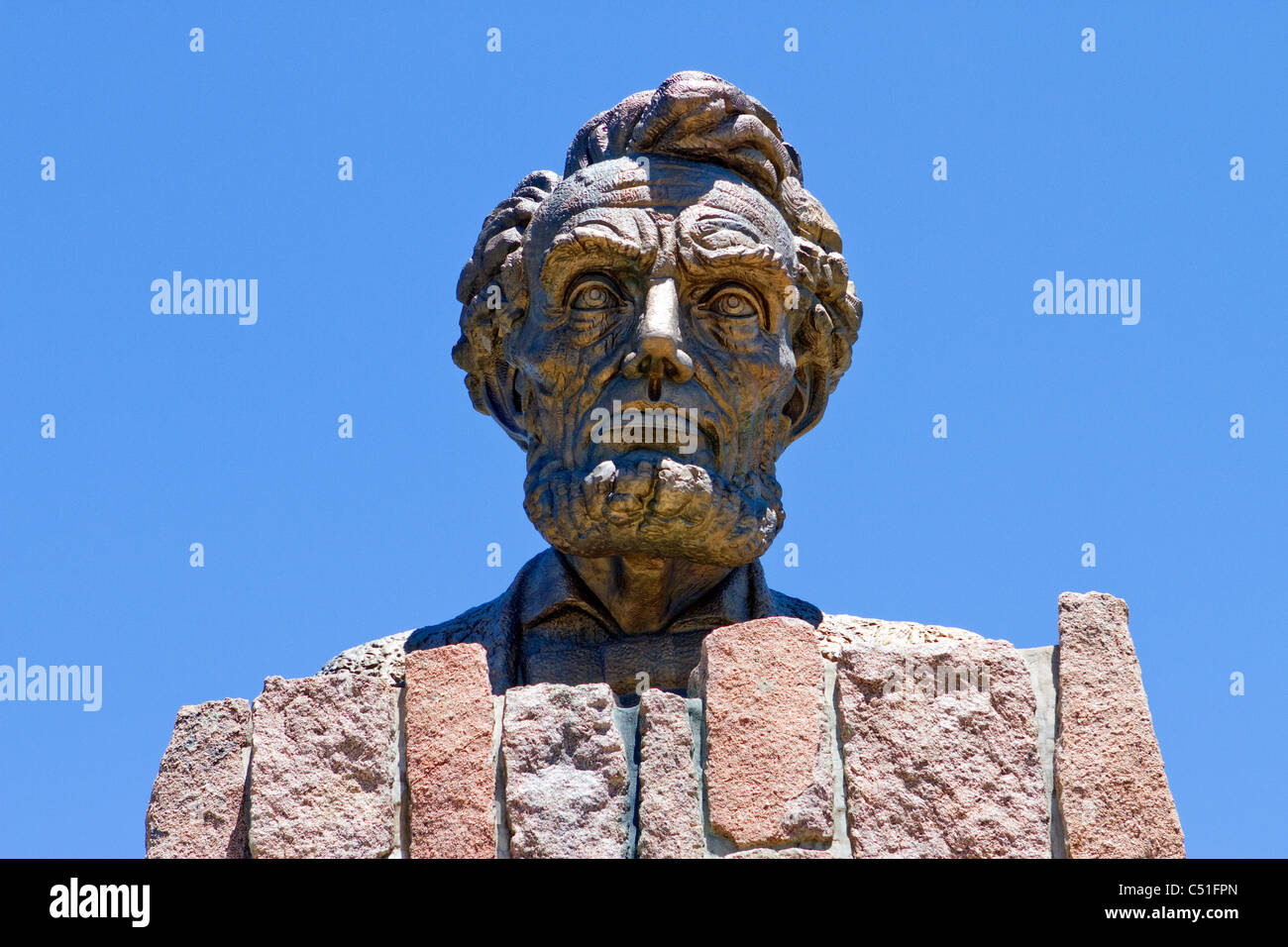 Robert Russi's bronze sculpture of Lincoln's head erected in honor of his 150th birthday on interstate 80 near Laramie, Wyoming. Stock Photo