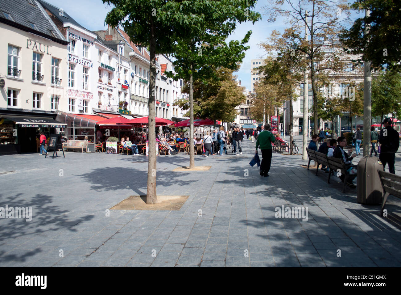 A public square in Antwerp Antwerpen, Belgium sits awash with summer sun sunshine sunlight. Stock Photo