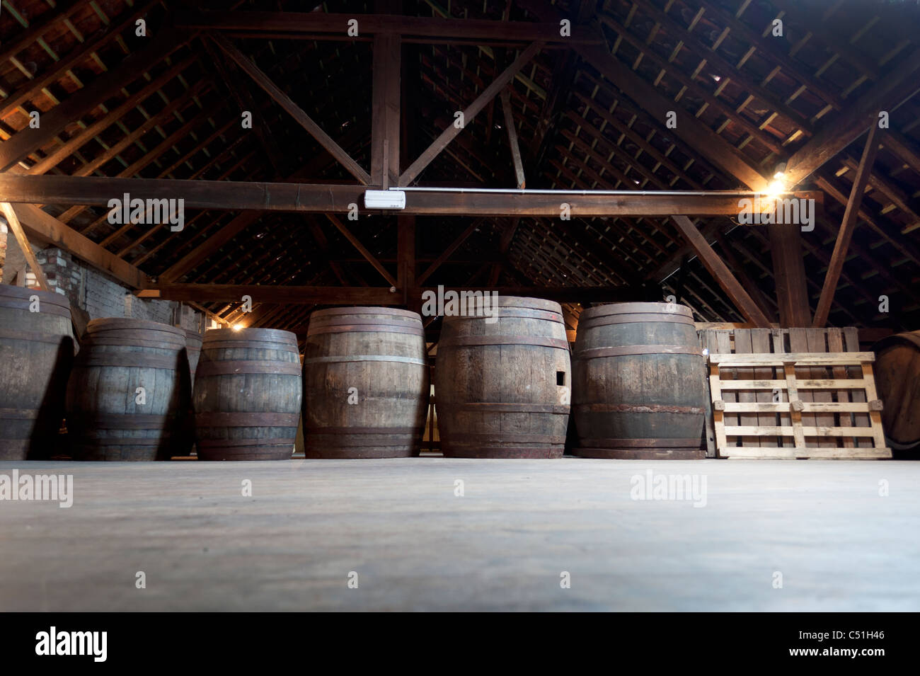 Barrels containing beer stack near to each other in the Cantillon brewery in Brussels, Belgium. Stock Photo