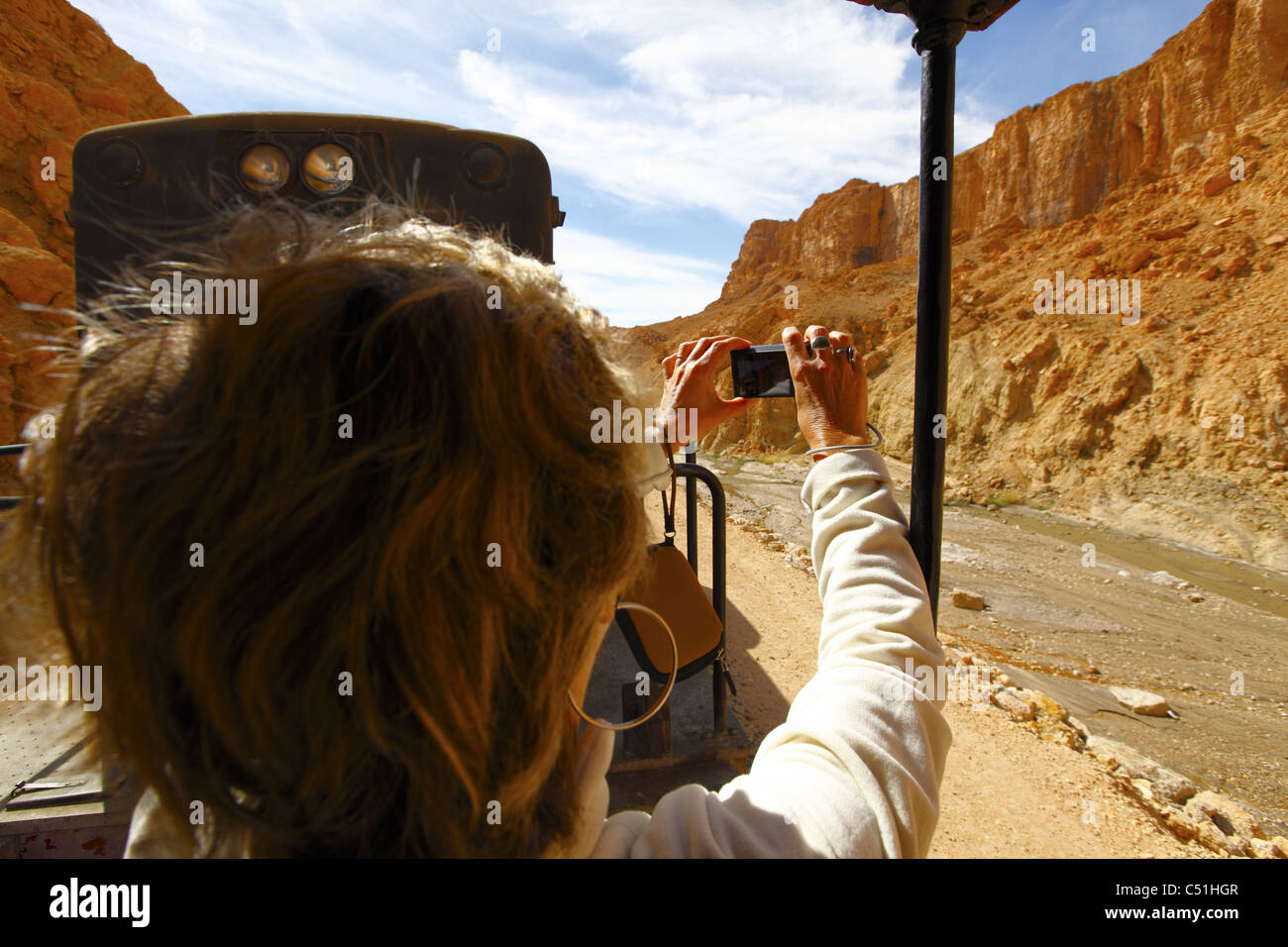 Africa, Tunisia, Metlaoui, Red Lizard ( Lezard Rouge ) Train, Sightseer Photographing Cliffs Stock Photo