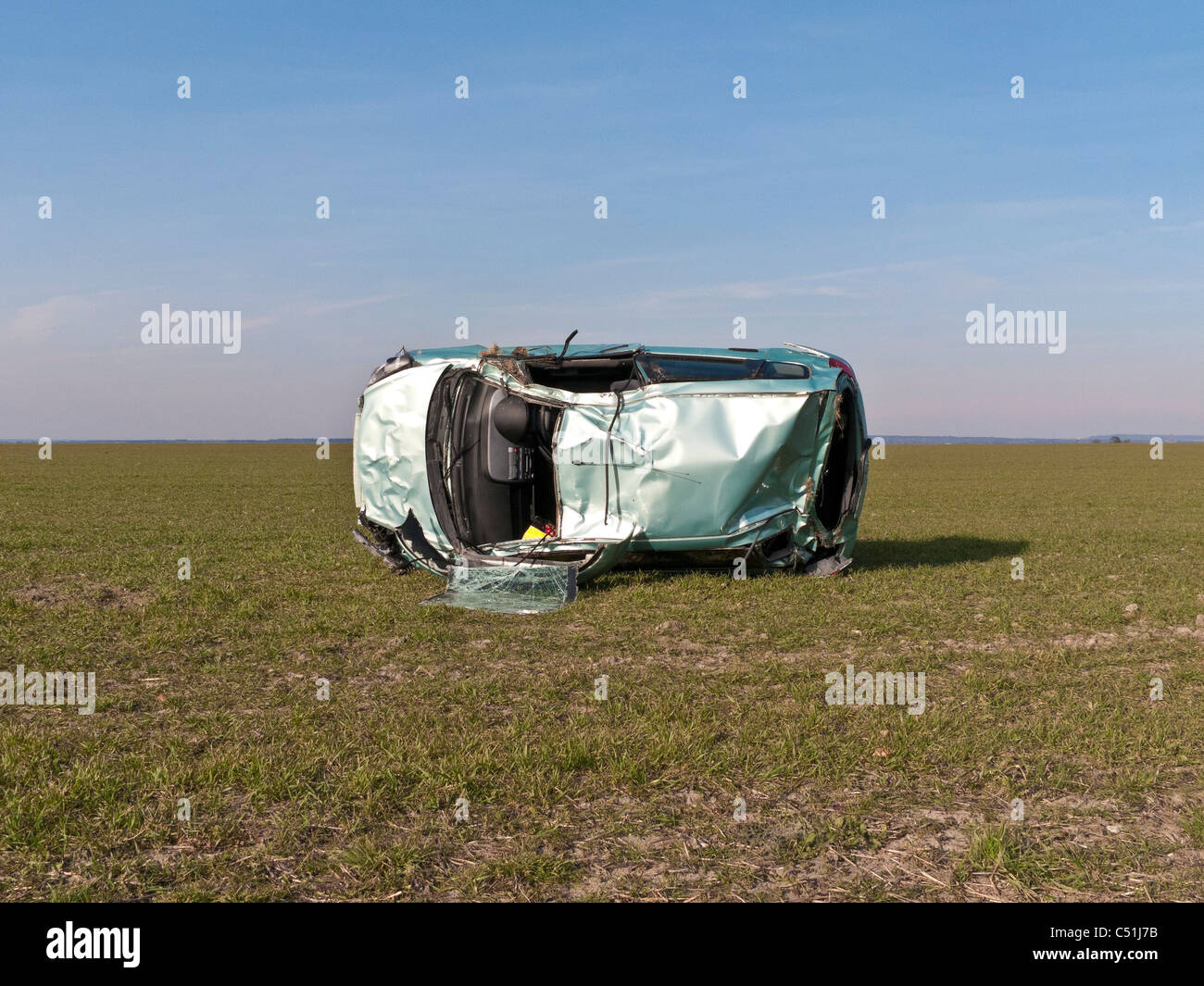 Honda Jazz car accident wrecked rolled in field. JMH5080 Stock Photo