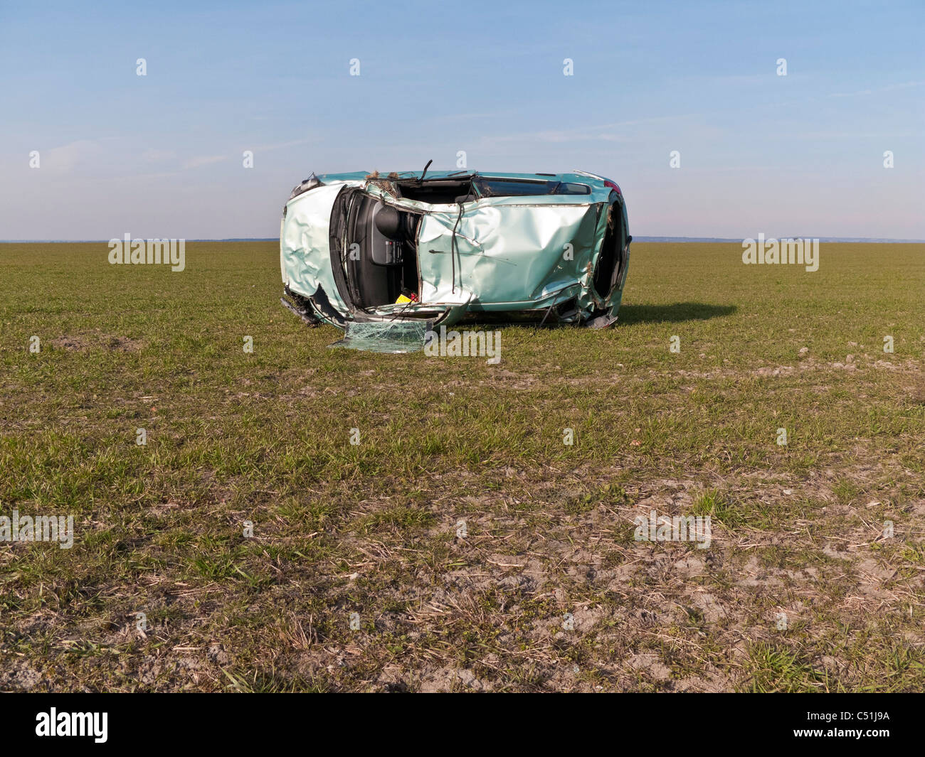 Honda Jazz car accident wrecked rolled in field. JMH5082 Stock Photo