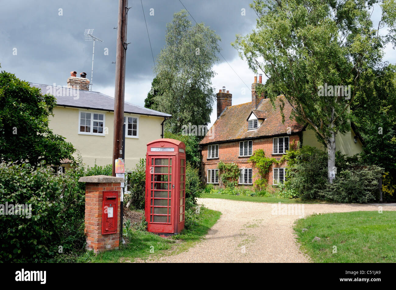 Quite corner of Braughing Village with houses telephone box and letter ...