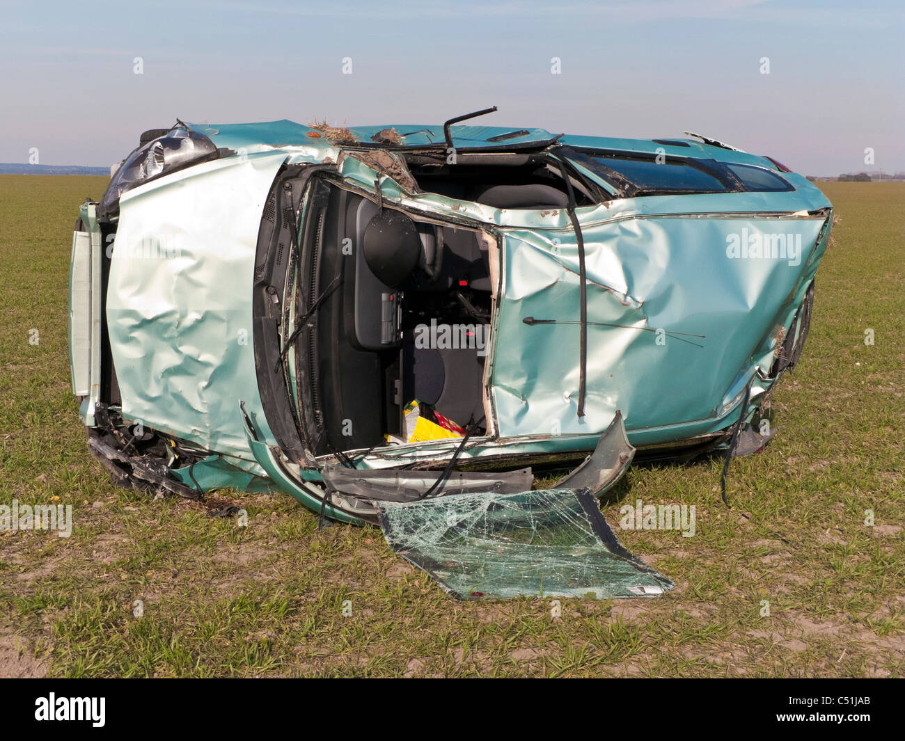 Honda Jazz car accident wrecked rolled in field. JMH5084 Stock Photo