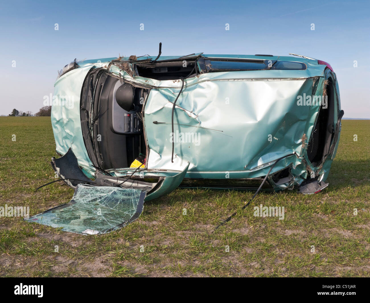 Honda Jazz car accident wrecked rolled in field. JMH5085 Stock Photo