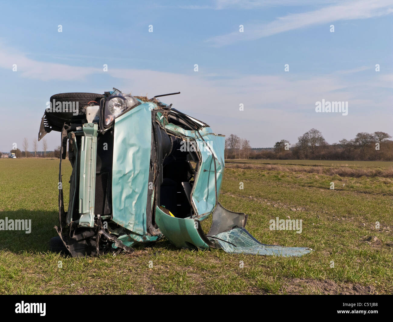 Honda Jazz car accident wrecked rolled in field. JMH5086 Stock Photo