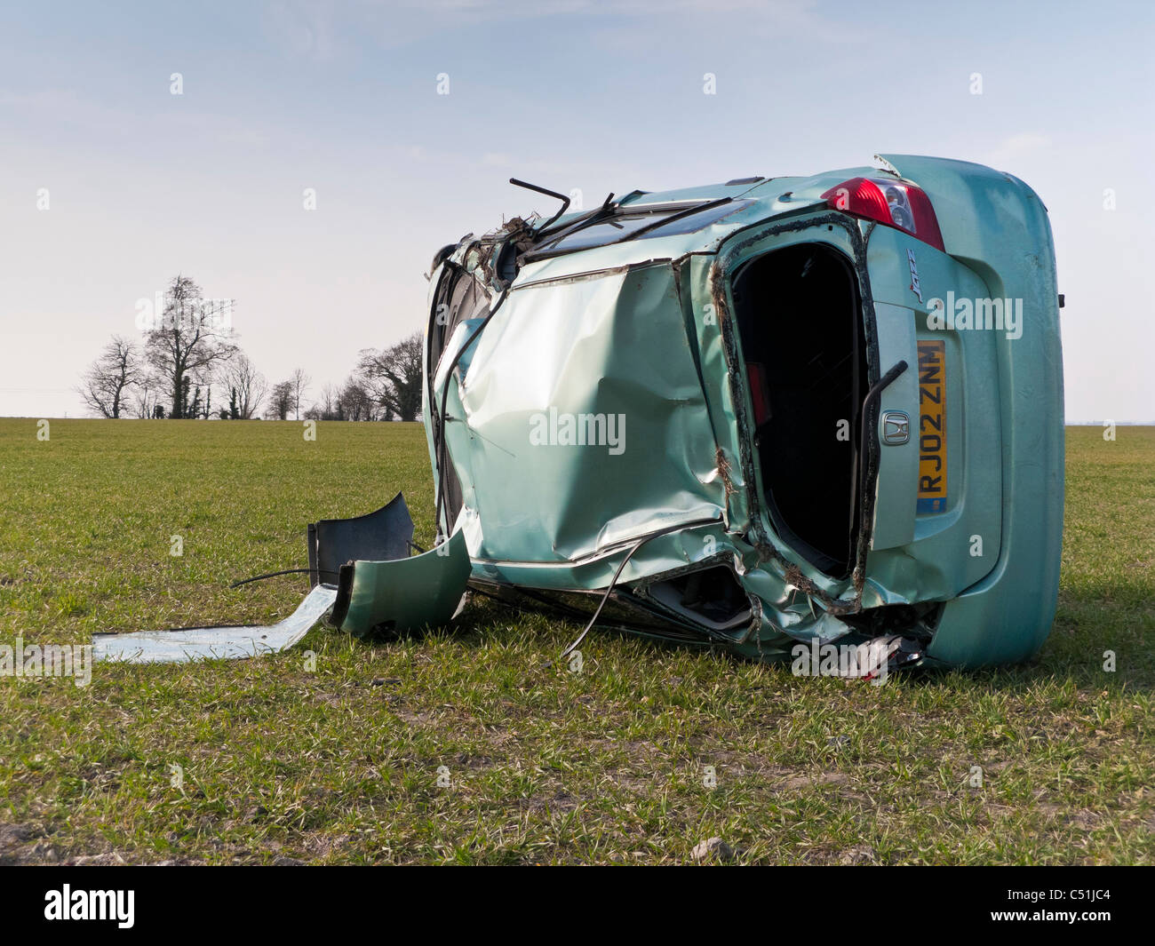 Honda Jazz car accident wrecked rolled in field. JMH5088 Stock Photo