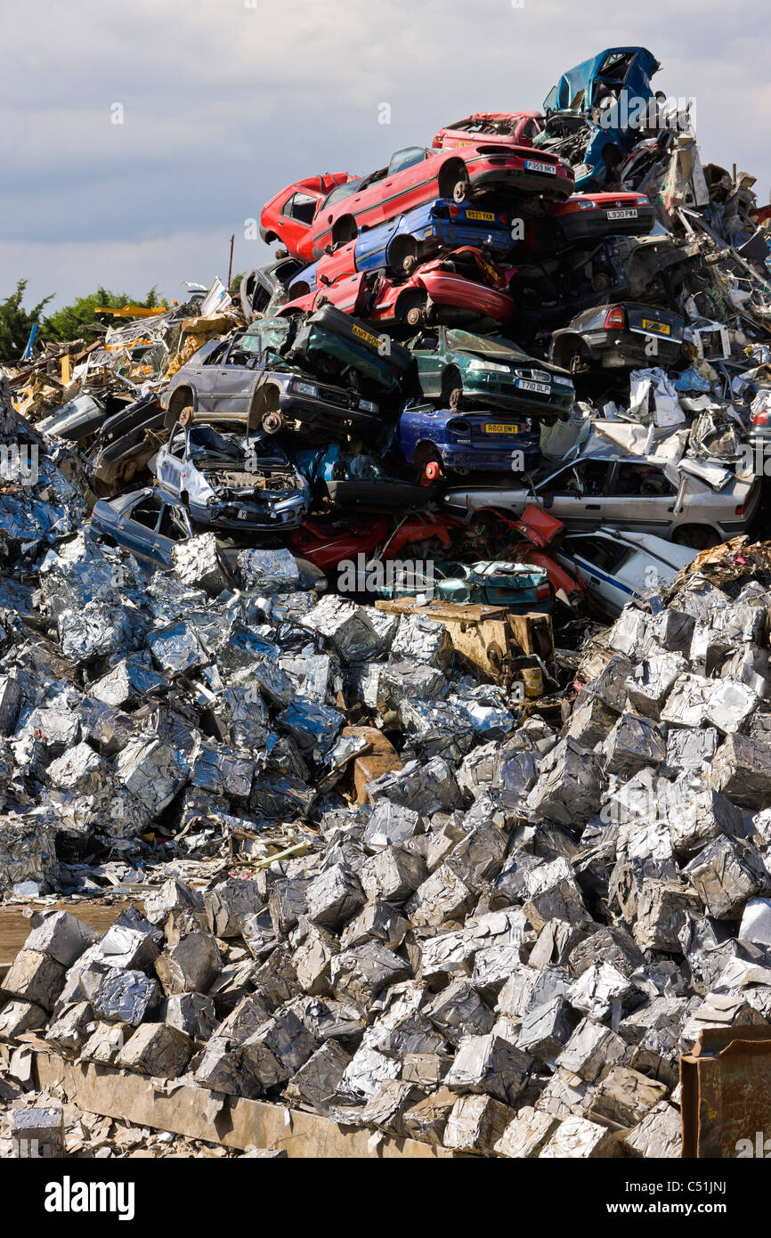 Unwanted old cars scrapped and crushed into cubes at recycling scrapyard. JMH5099 Stock Photo