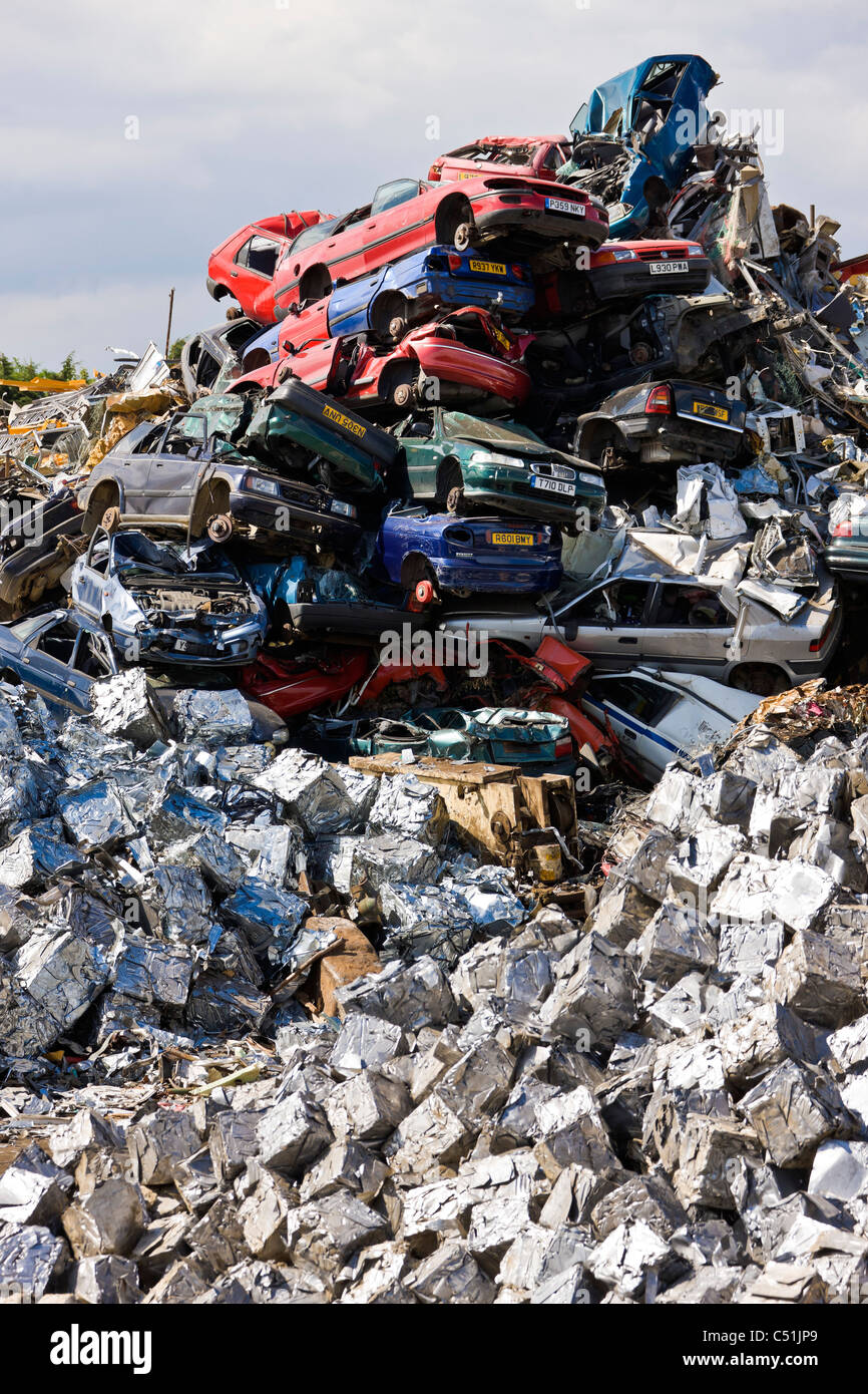 Unwanted old cars scrapped and crushed into cubes at recycling scrapyard. JMH5100 Stock Photo