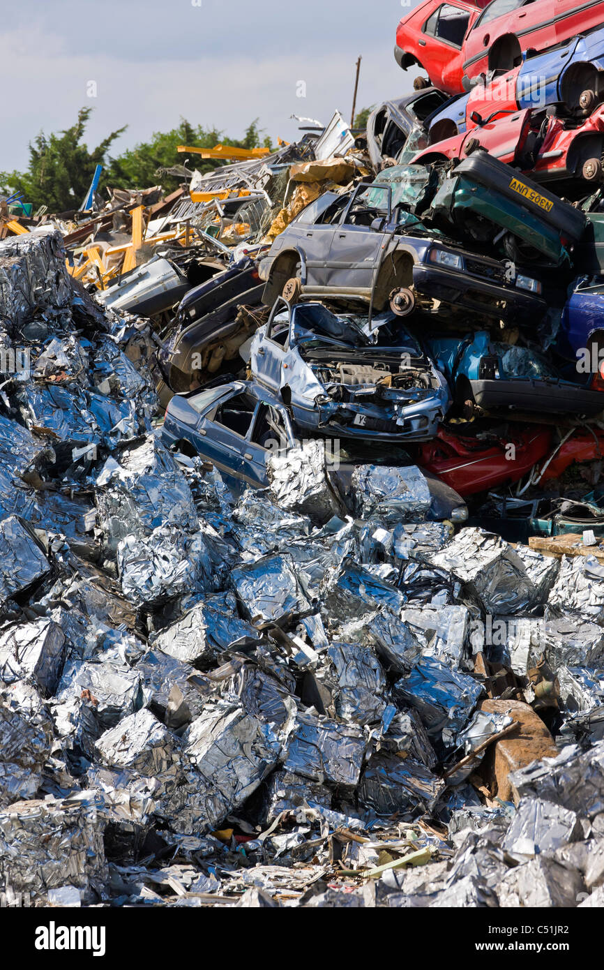 Unwanted old cars scrapped and crushed into cubes at recycling scrapyard. JMH5101 Stock Photo
