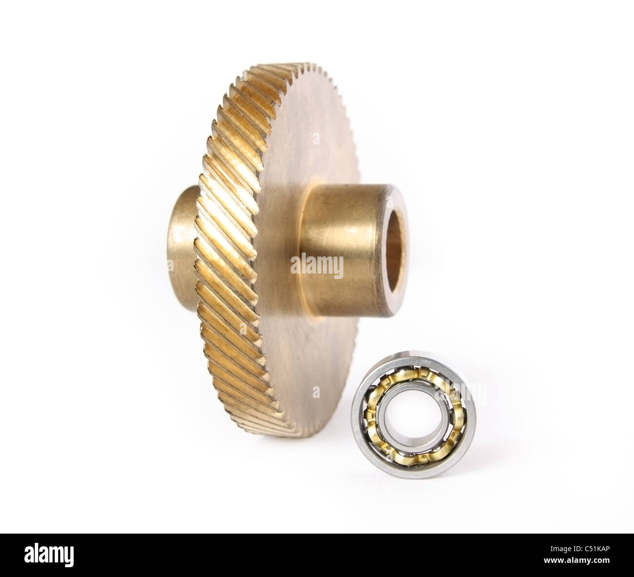 Bronze gear and ball bearing on a white background Stock Photo