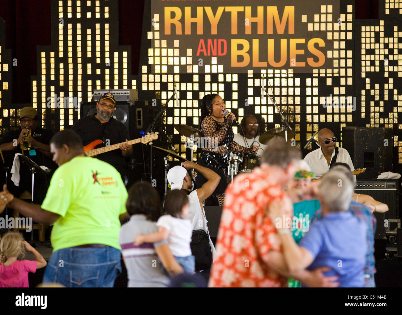 Concert goers dance in front of a Rhythm and Blues concert Stock Photo
