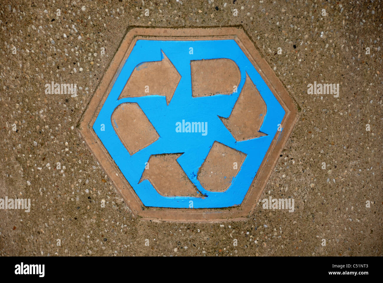 The universal recycling symbol  is an internationally recognized symbol used to designate recyclable materials.  On a trash can. Stock Photo