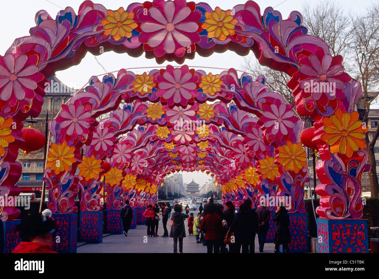 People Walking Under a Chinese New Year Decoration, Xian City, Shaanxi, China Stock Photo