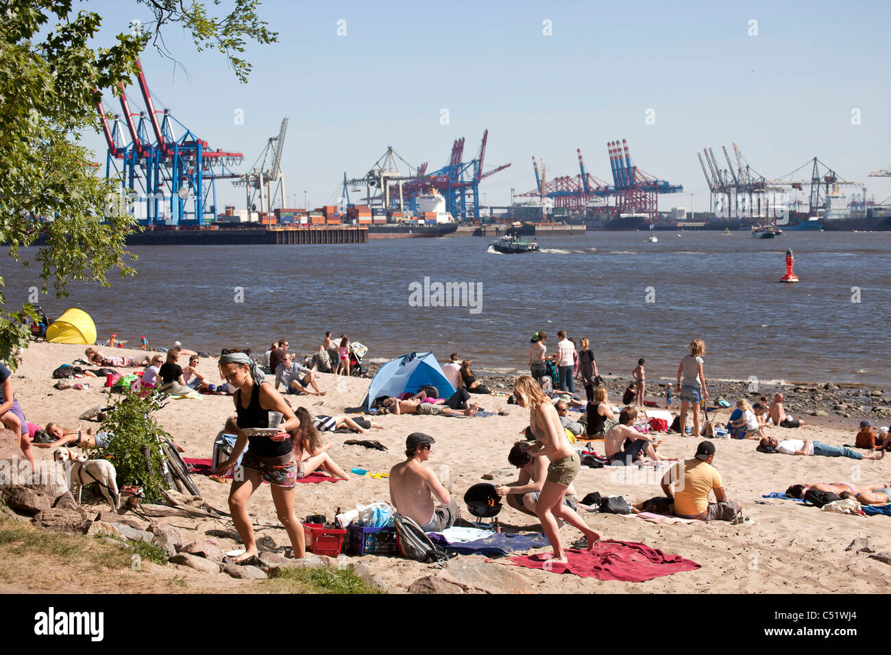 sunbathers, river Elbe shore in Oevelgoenne, Hanseatic City of Hamburg, Germany, Europe Stock Photo