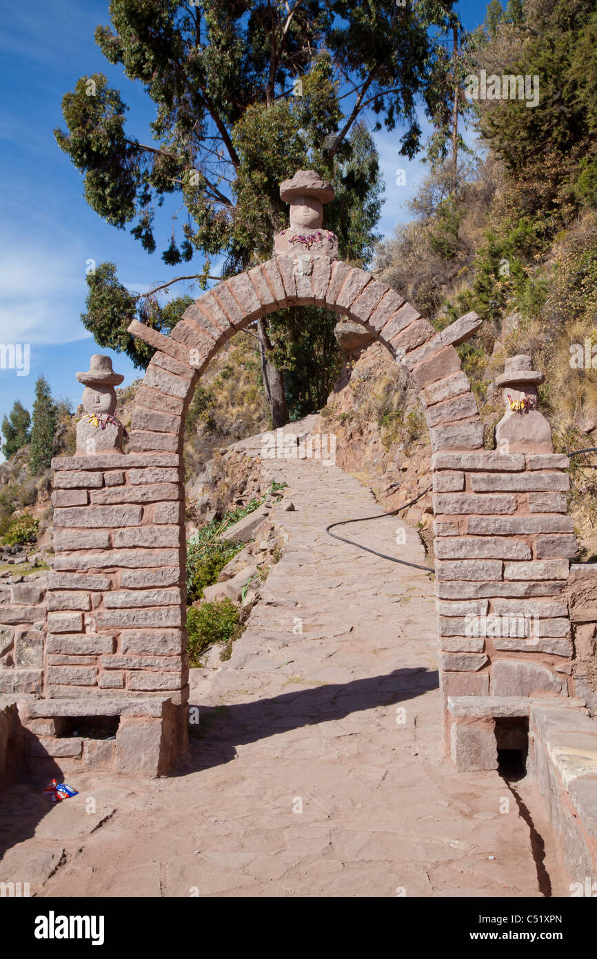 Stone archway at the entrance to Isla Taquile, Lake Titicaca, Peru Stock Photo