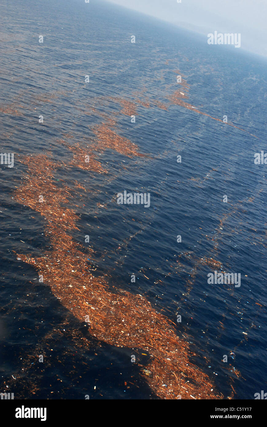 Aerial view of debris fields in the Pacific following the massive earthquake and tsunami in Japan. Stock Photo
