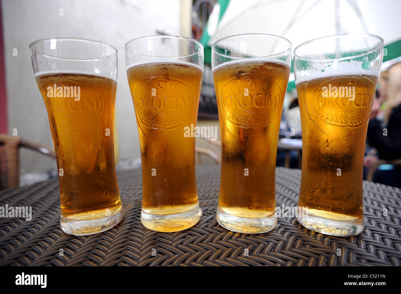Four pints of Okocim Mocne a strong polish beer Stock Photo