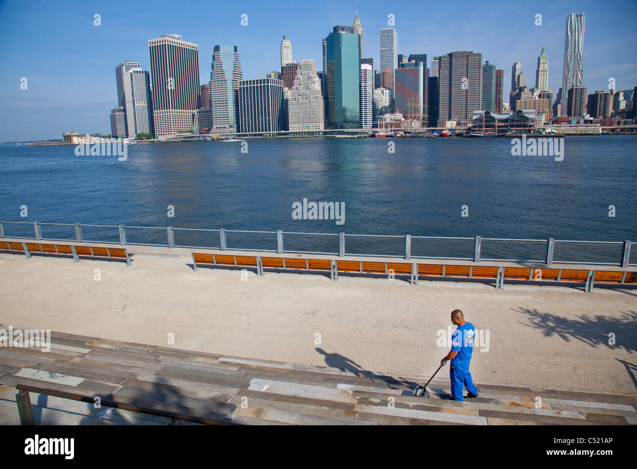 Cleaning Brooklyn Bridge park Stock Photo Alamy