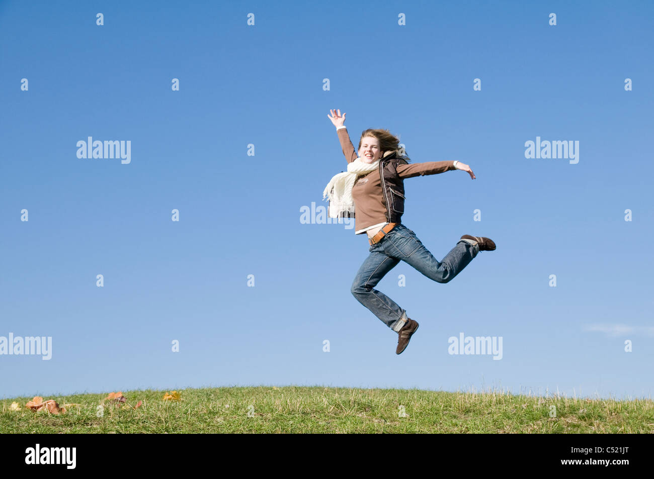 Woman jumping for joy, Jena, Thuringia, Germany Stock Photo