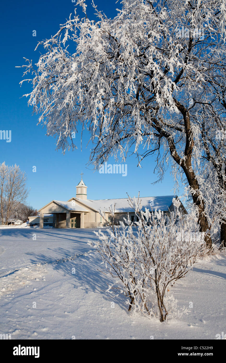 The Maranatha Church building with hoar frost covered trees in Winkler, Manitoba, Canada Stock