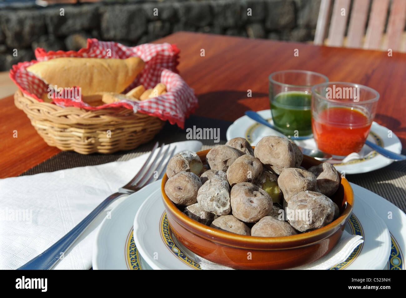 Traditional Canarian cuisine, Canarian wrinkly potatoes, Papas Arrugadas with Rojo Mojo and Mojo Verde sauces, Tenerife Stock Photo