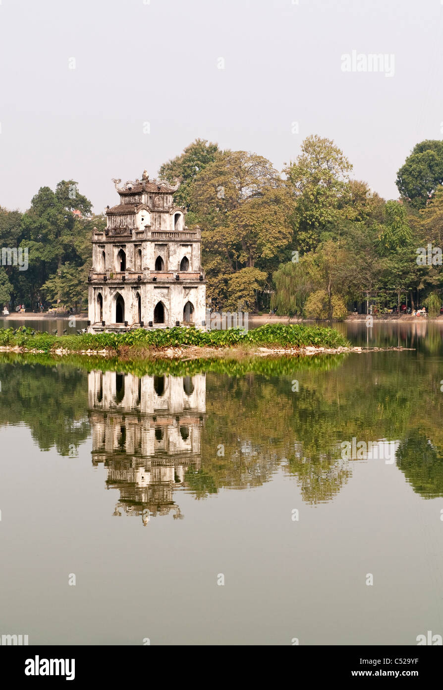 The historic Tortoise Tower, Thap Rua, reflected in the waters of Hoan Kiem Lake, Hanoi, Vietnam Stock Photo
