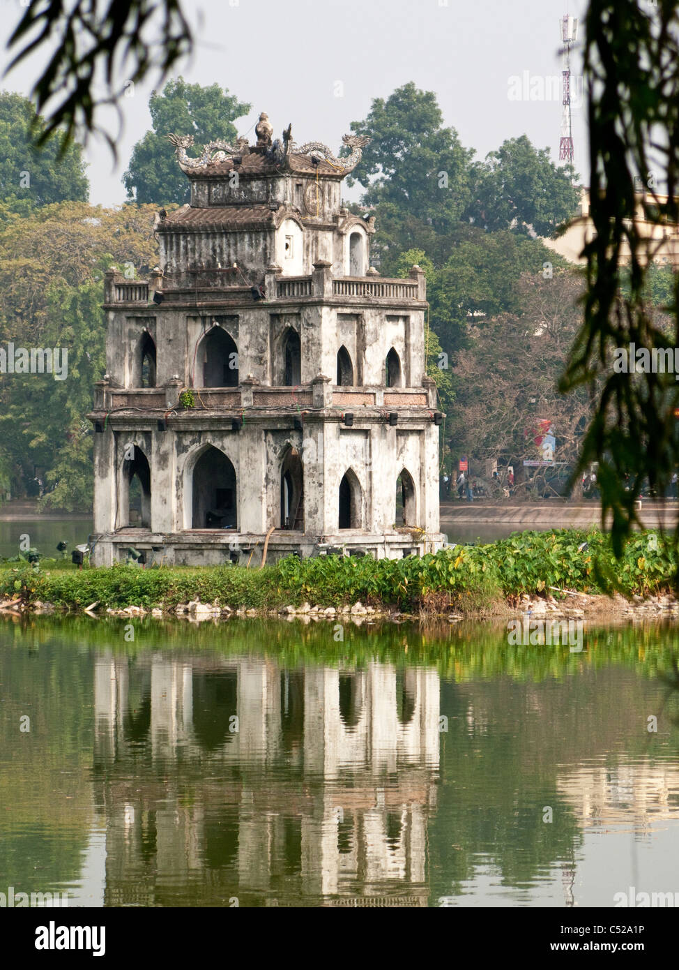 The historic Tortoise Tower, Thap Rua, reflected in the waters of Hoan Kiem Lake, Hanoi, Vietnam Stock Photo