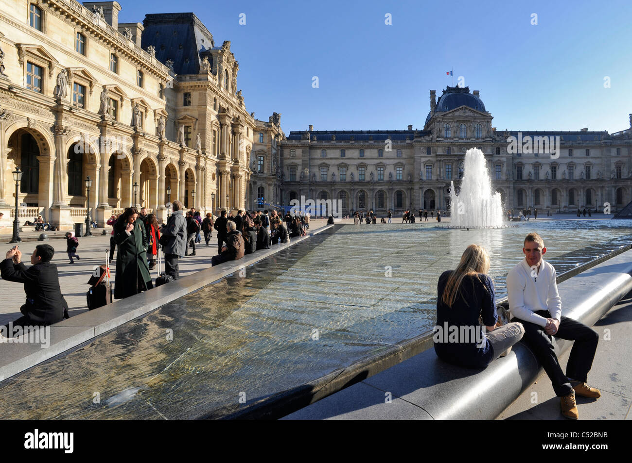 Louvre Museum and visitors Paris France Stock Photo
