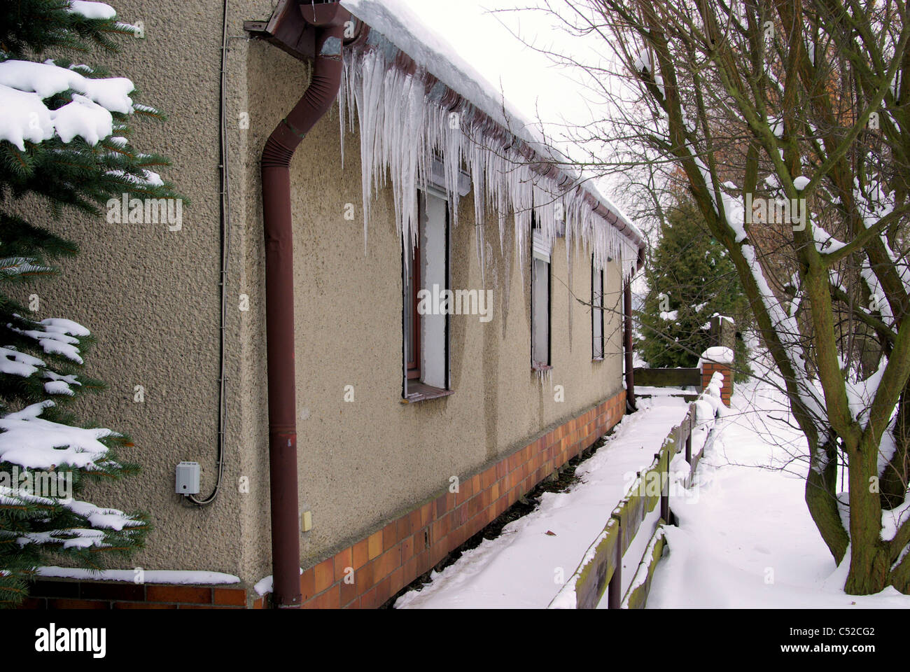 Eiszapfen am Haus - icicle on house 01 Stock Photo