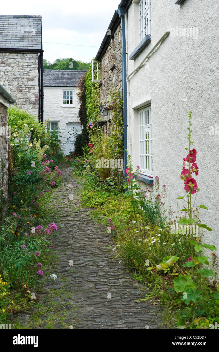 Traditional Victorian terraced cottages on narrow cobbled lane in village of Llangattock Powys South Wales UK Stock Photo