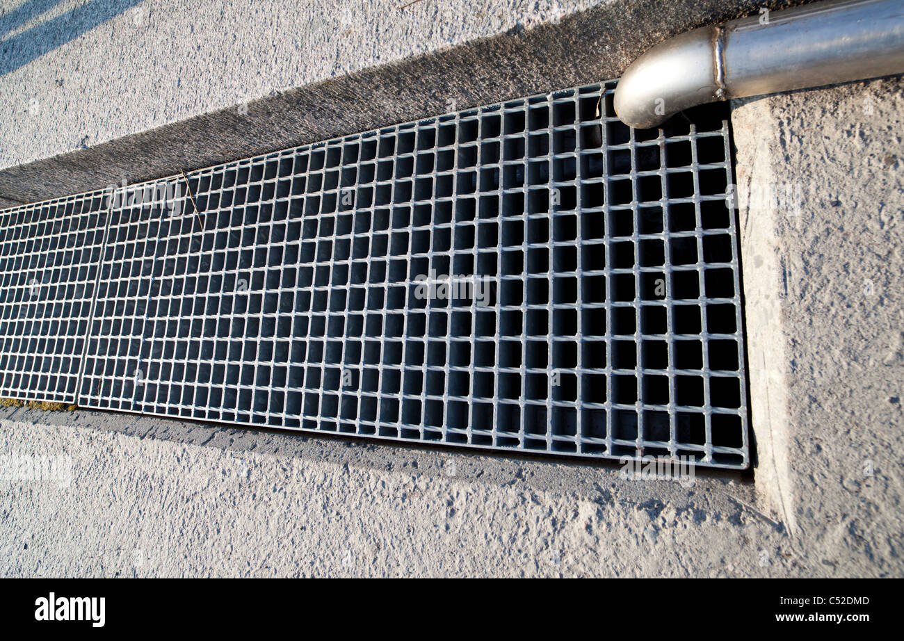 Metal mesh protecting drainage hole Stock Photo