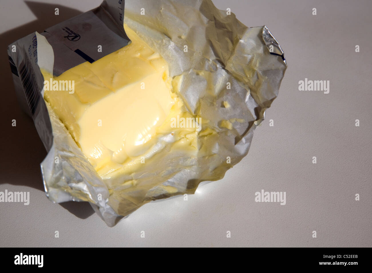 Butter in Foil Wrapper Stock Photo Alamy