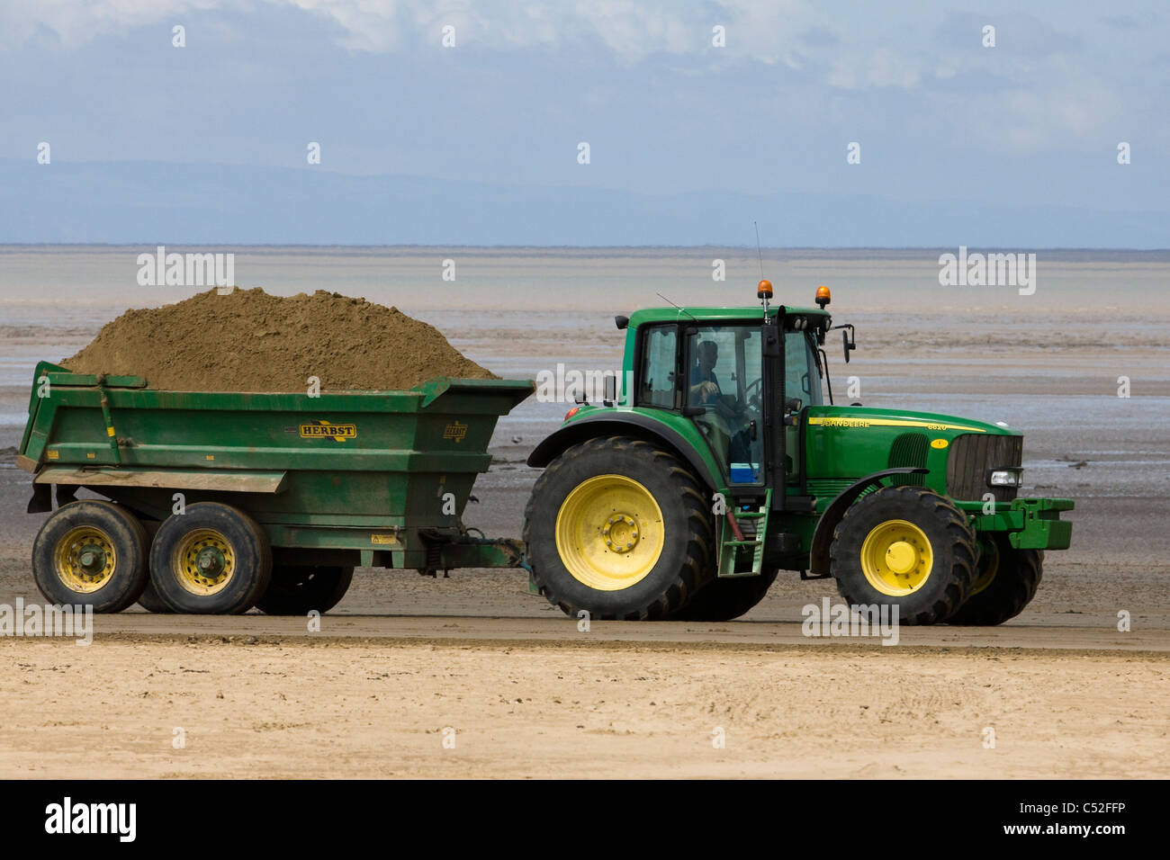 Tractor moving sand hires stock photography and images Alamy