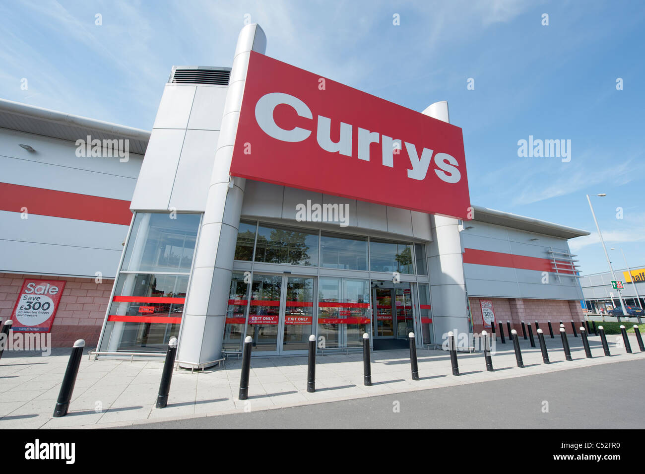 The storefront of the electrical retailer Currys on a retail park, Manchester. (Editorial use only). Stock Photo