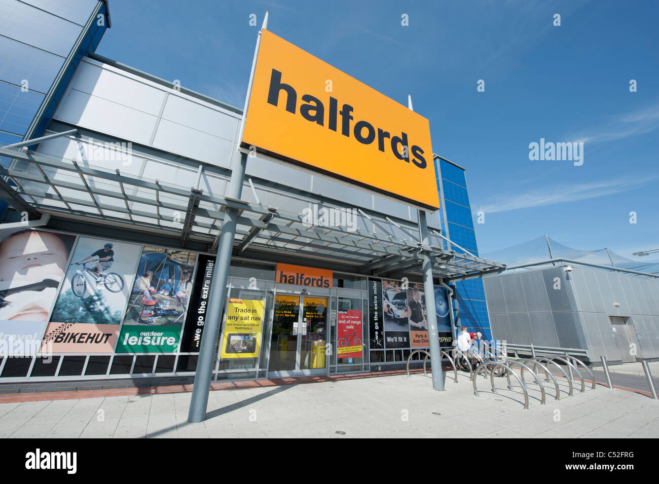 The storefront of the car parts, car enhancement and bicycle retailer Halfords on a retail park. (Editorial use only). Stock Photo