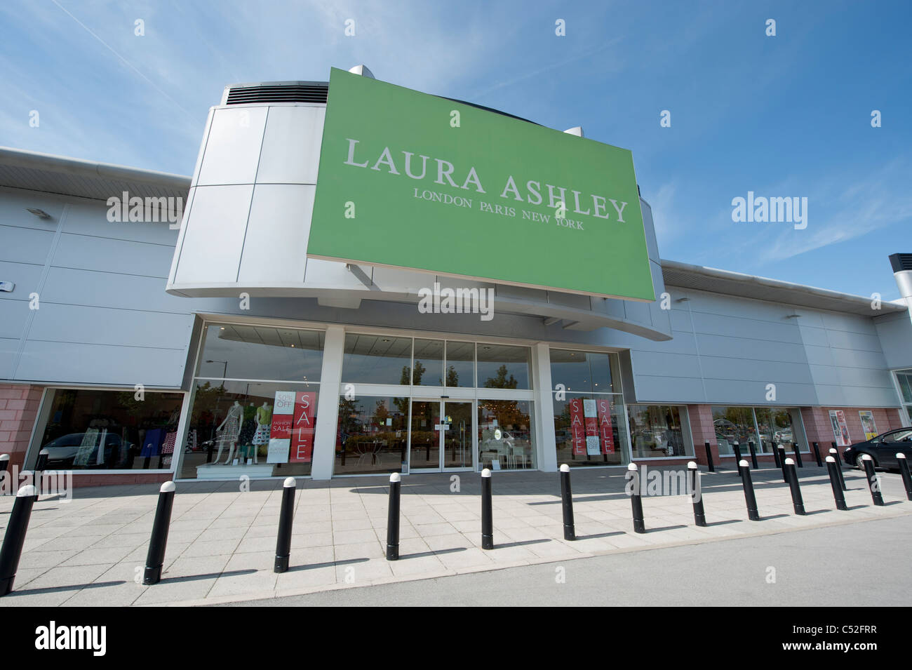 The storefront of the fashion retailer Laura Ashley on a retail park, Manchester. (Editorial use only). Stock Photo
