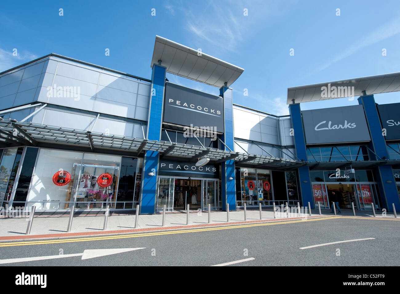 The storefront of the fashion retailer Peacocks on a retail park, Manchester. (Editorial use only). Stock Photo