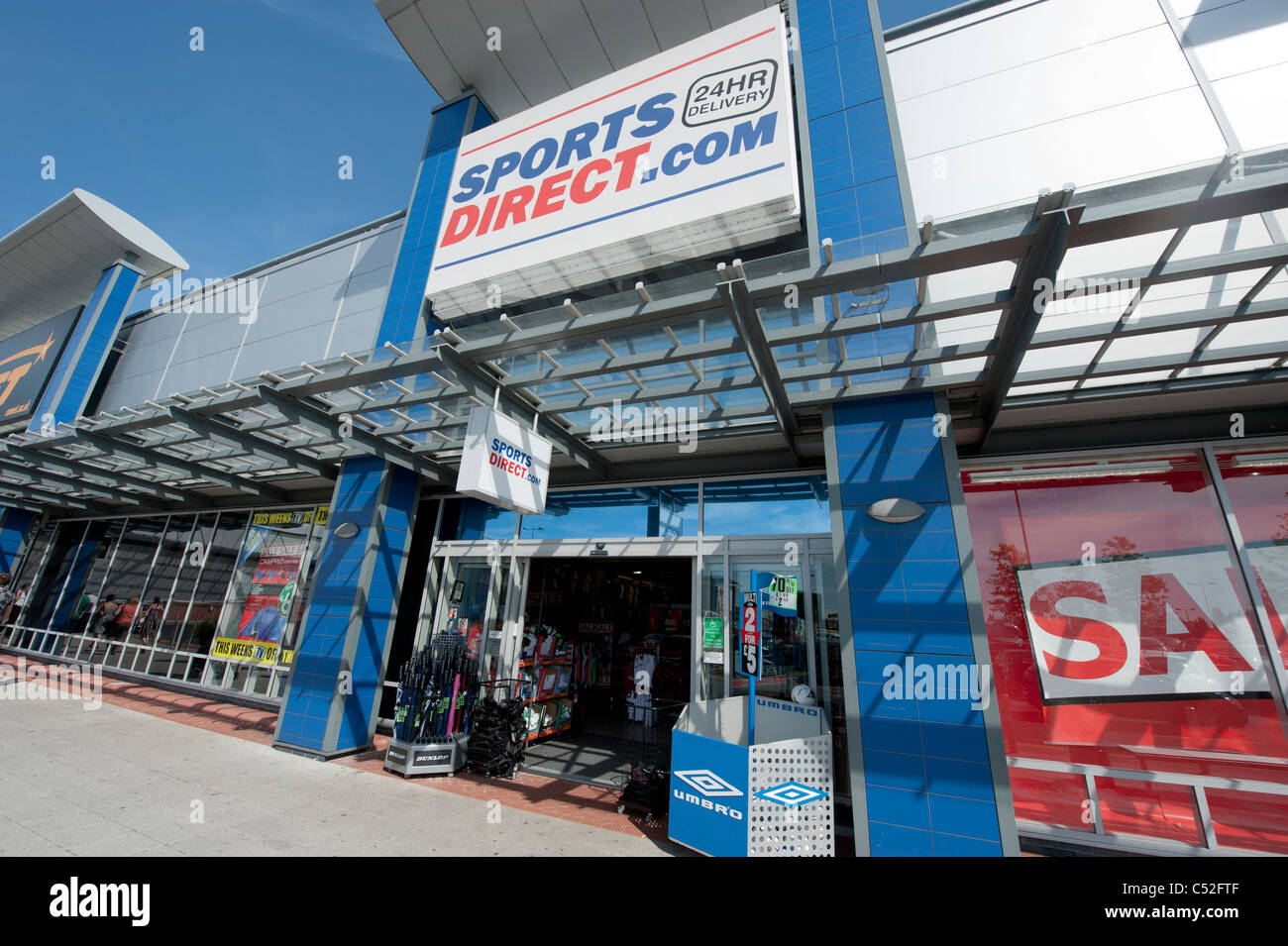 The storefront of the sportswear retailer Sports Direct on a retail park, Manchester. (Editorial use only). Stock Photo