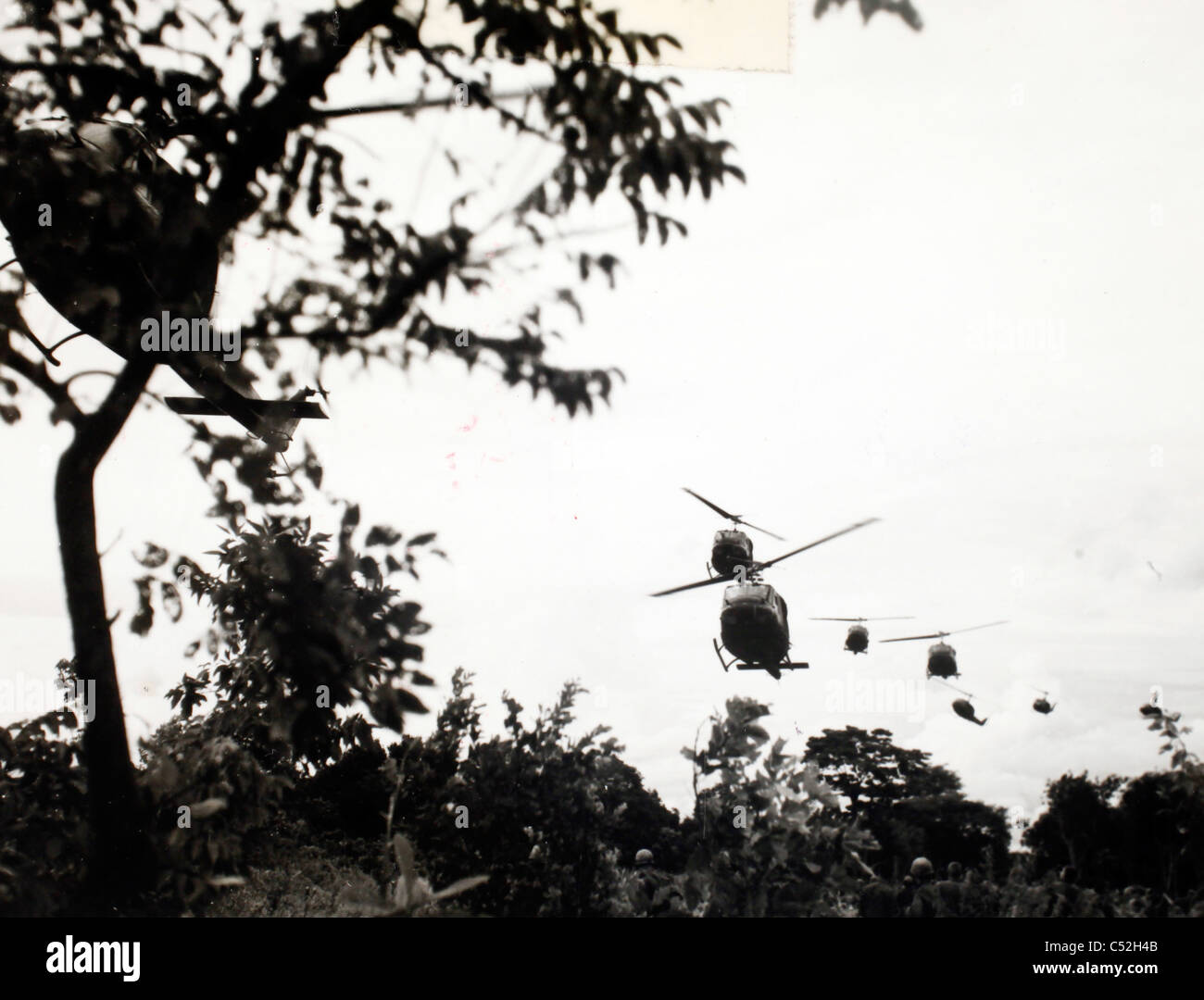 Huey helicopters approaching landing zone in jungle north of Bien Hoa 21 September 1965. Vietnam War UH-1D Stock Photo