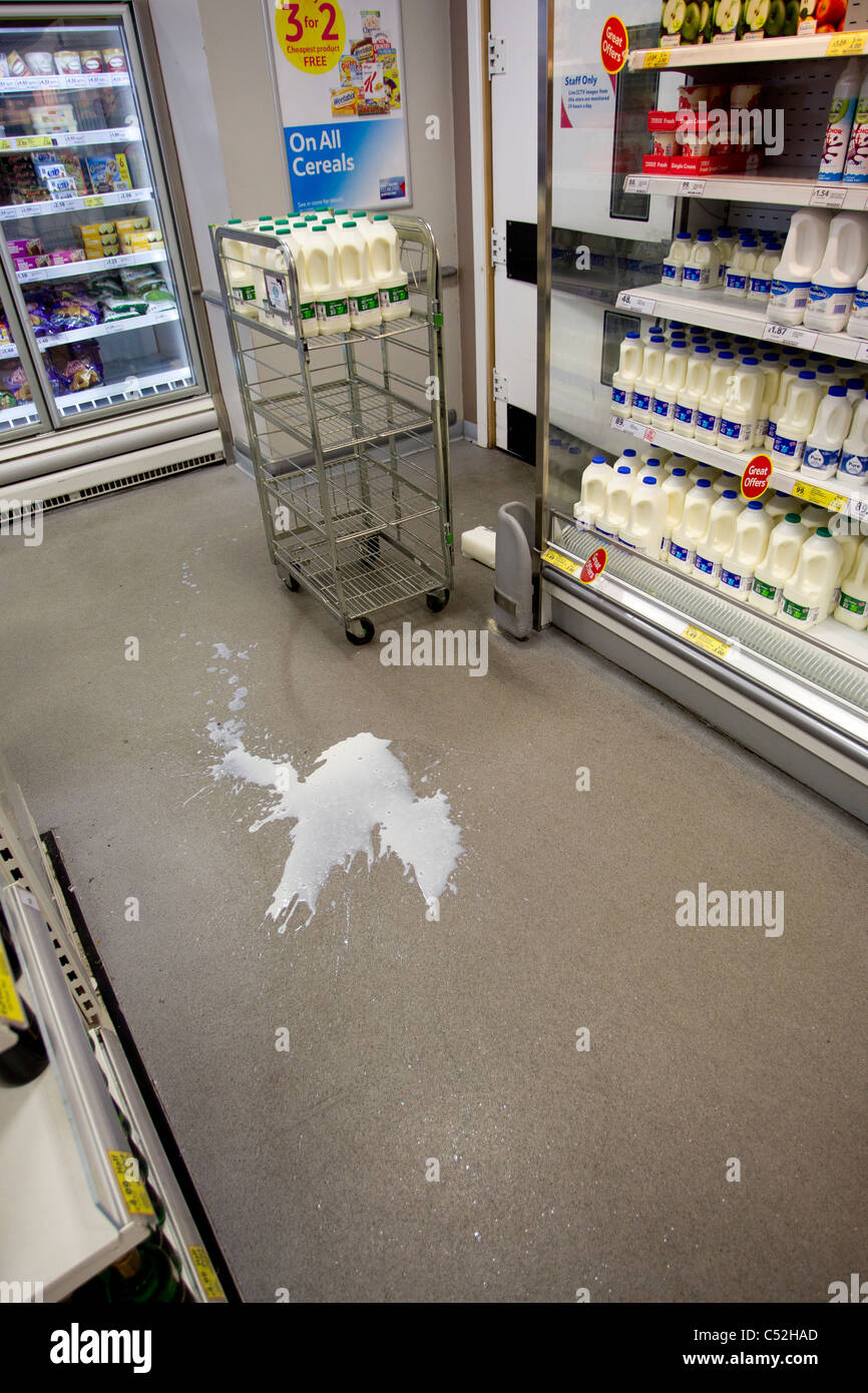 Spilt milk accident at a supermarket Stock Photo