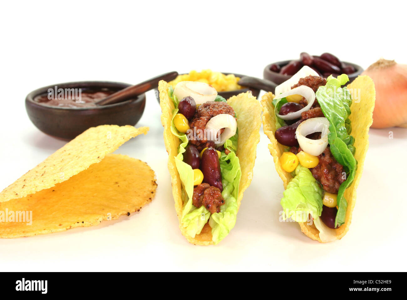 Mexican tacos with ground beef, lettuce, red kidney beans and corn on a