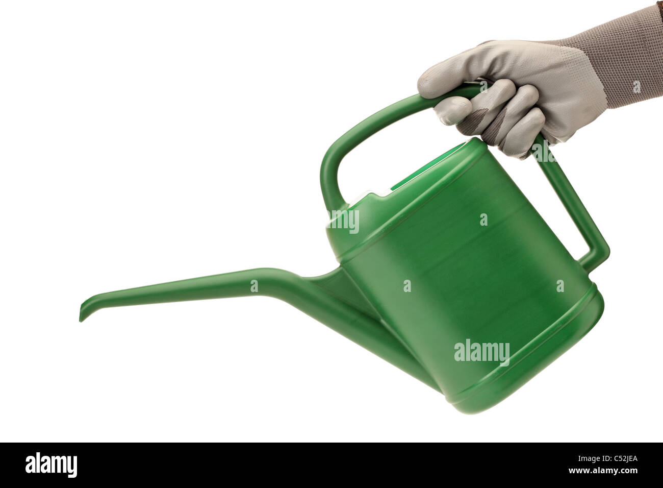 A person with gardening glove holding a watering can Stock Photo